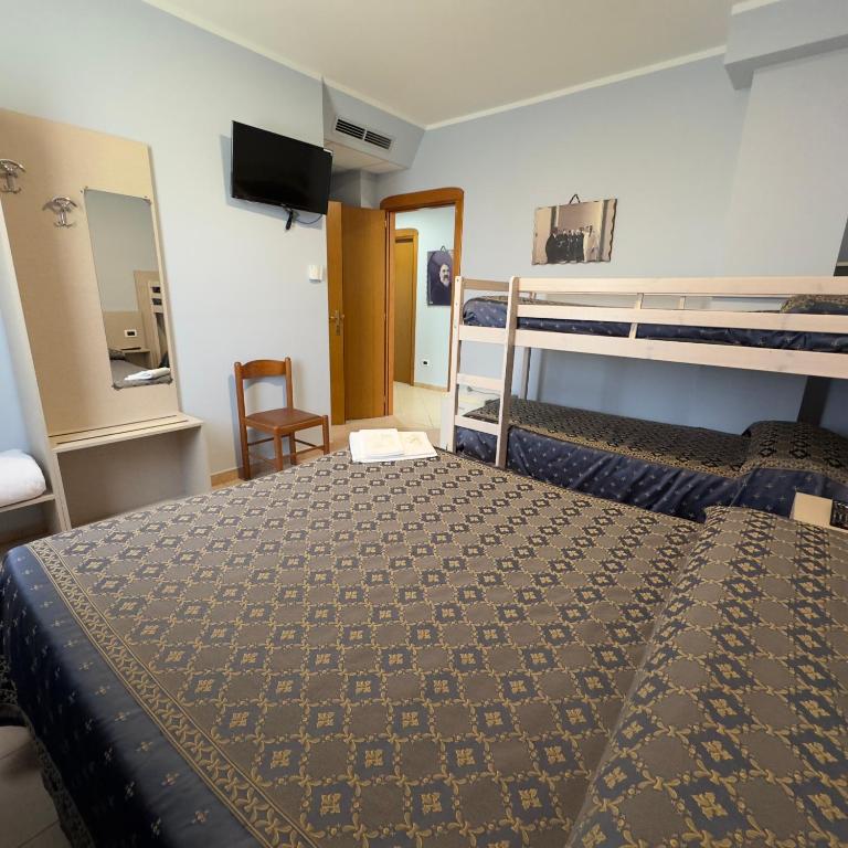 Postel nebo postele na pokoji v ubytování Hotel Immagine