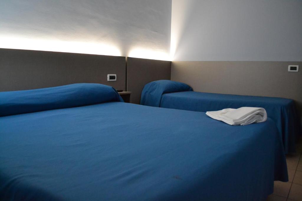 Postel nebo postele na pokoji v ubytování Hotel Immagine