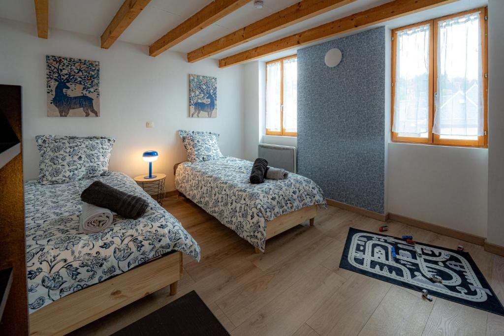 En eller flere senge i et værelse på La cachette historique 3 chambres