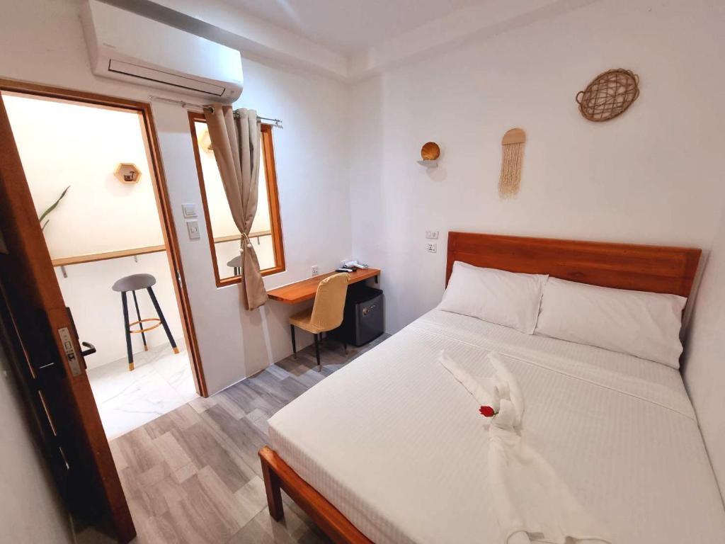 Postel nebo postele na pokoji v ubytování CiNta Hotel