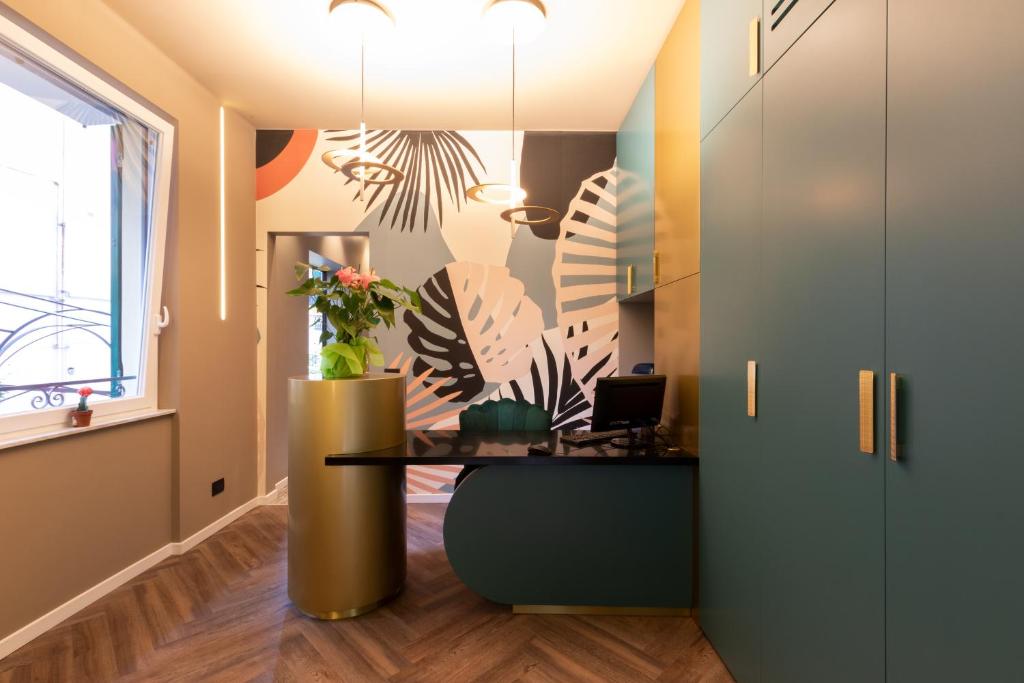 an office with a desk in a room at The Time -Home & Hotel- in Santa Margherita Ligure