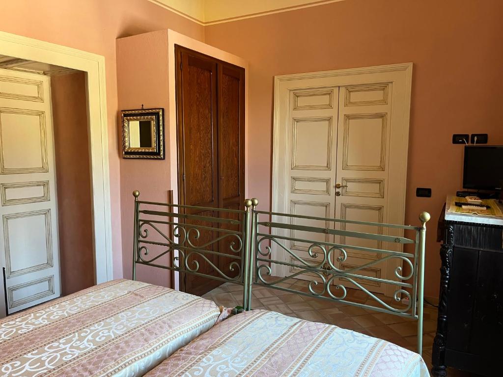 Postel nebo postele na pokoji v ubytování Palazzo Cutrufelli