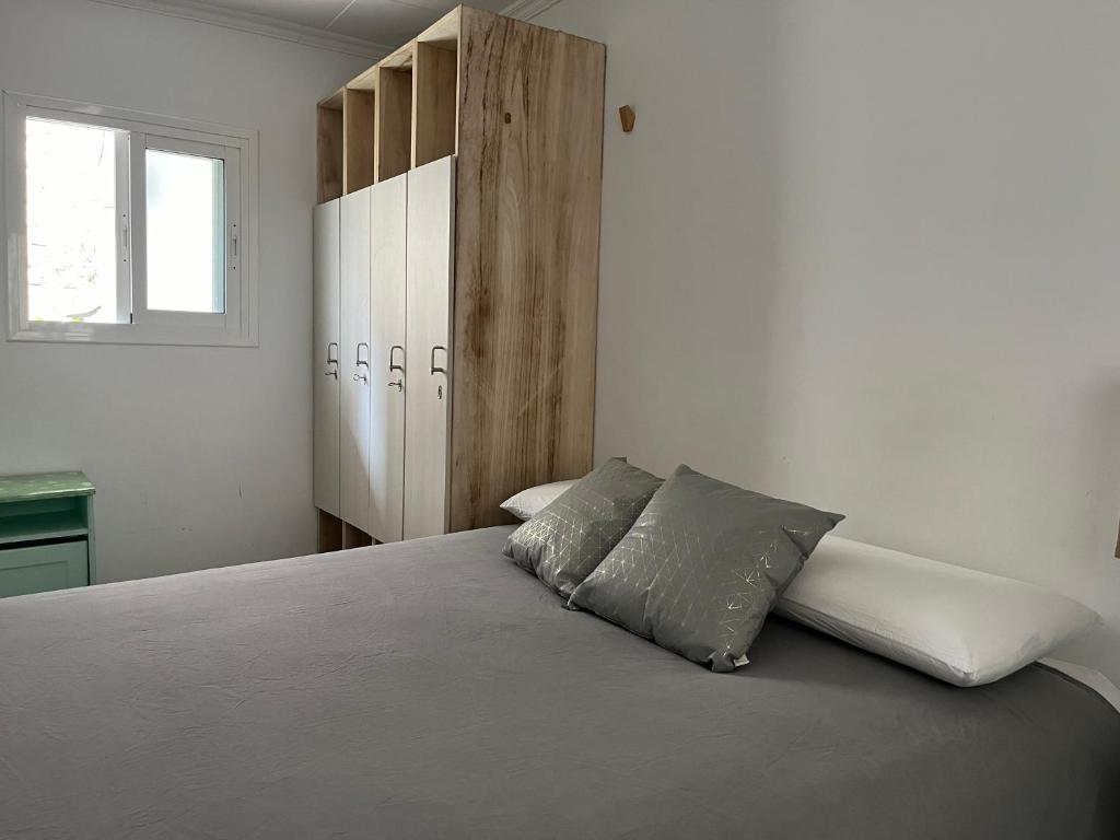 A bed or beds in a room at The Light appartment Tarragona