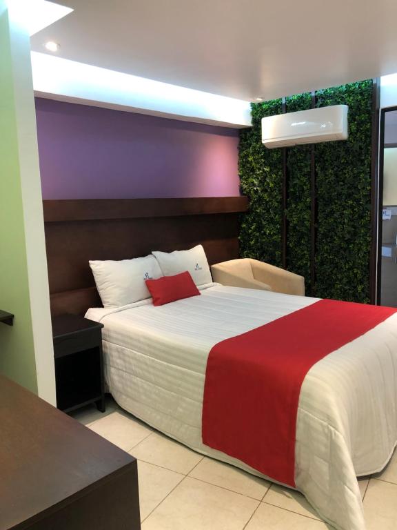 Postel nebo postele na pokoji v ubytování Hotel Imperial