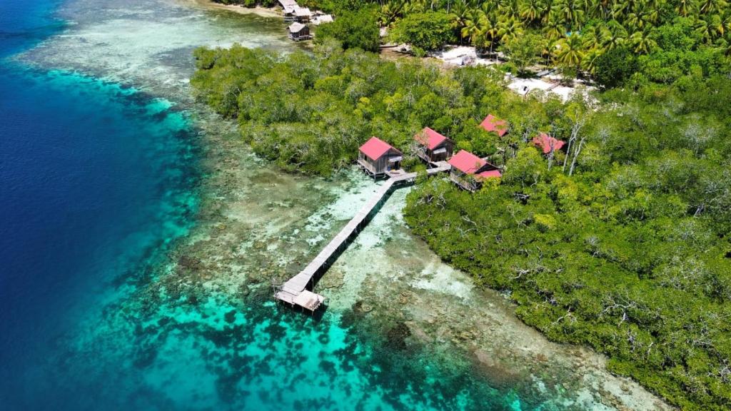 an aerial view of a resort on a island in the water at Raja Ampat Blue Sea in Besir
