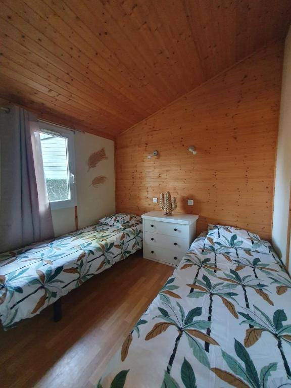 Postel nebo postele na pokoji v ubytování Chalet dans résidence les Pescalunes