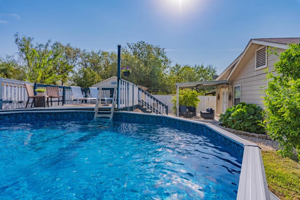 a swimming pool in front of a house at Superb House By Seaworld, Private Pool & Gameroom in San Antonio