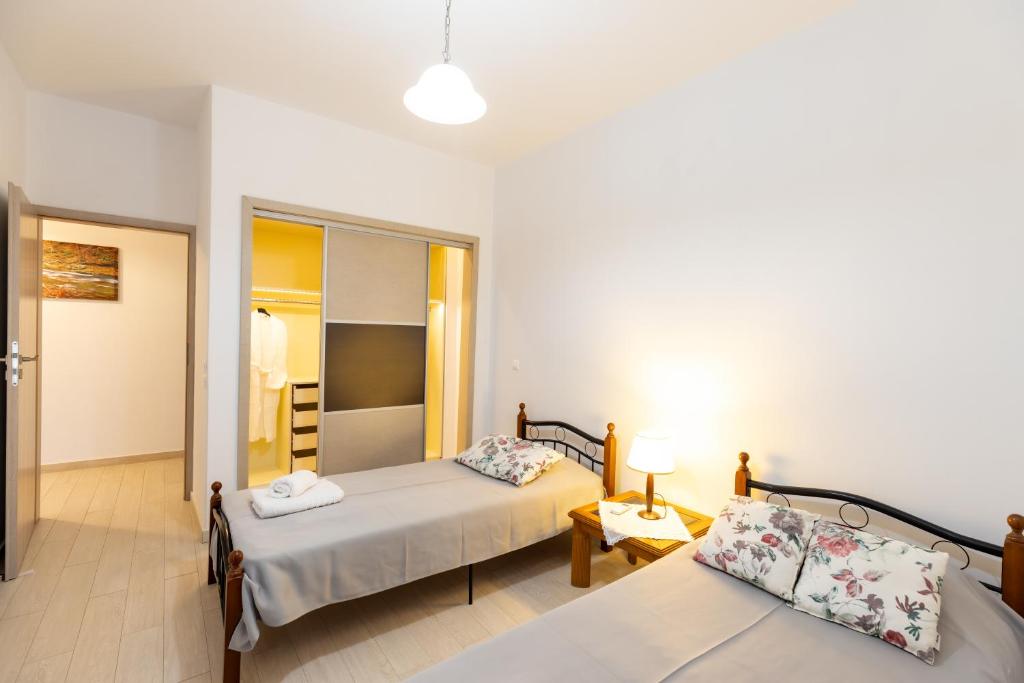 Postel nebo postele na pokoji v ubytování Mariangelo House
