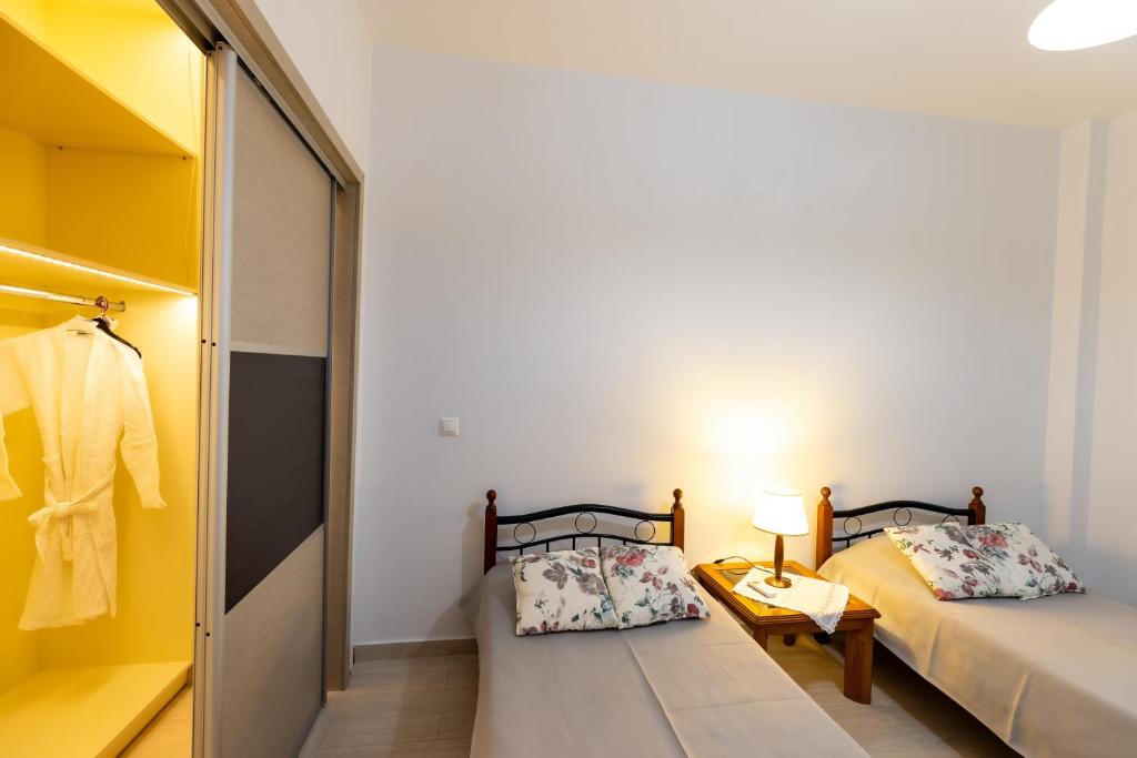 Postel nebo postele na pokoji v ubytování Mariangelo House