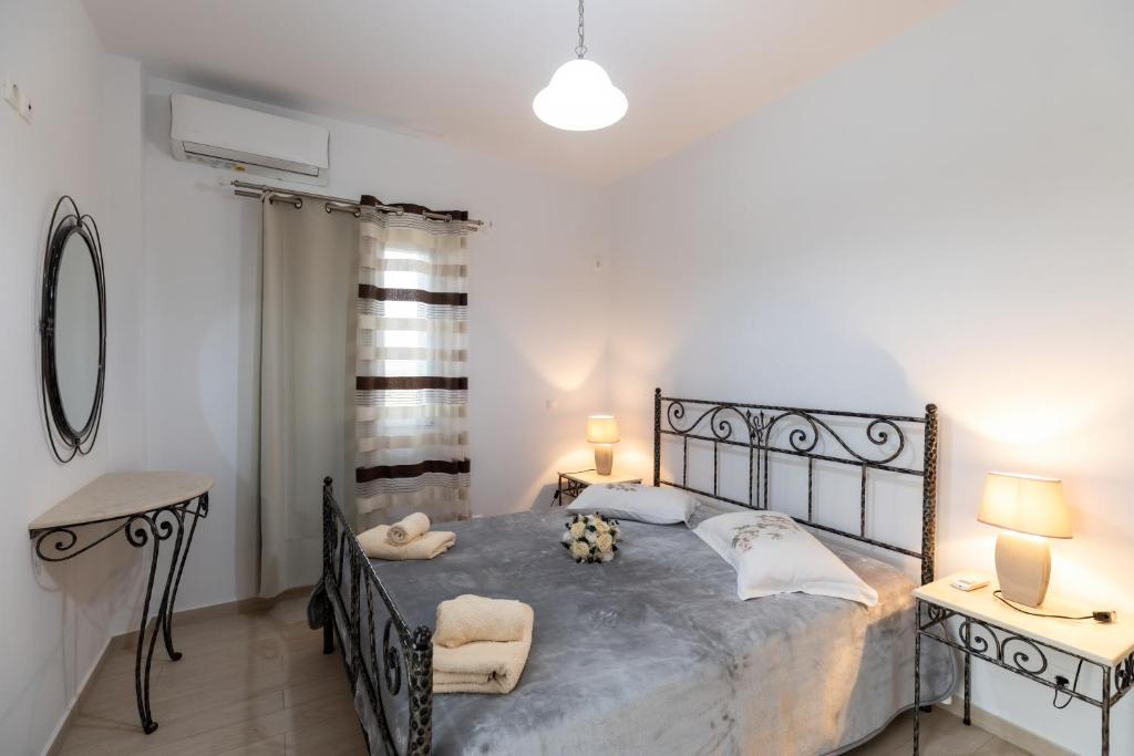 Postel nebo postele na pokoji v ubytování Mariangelo House