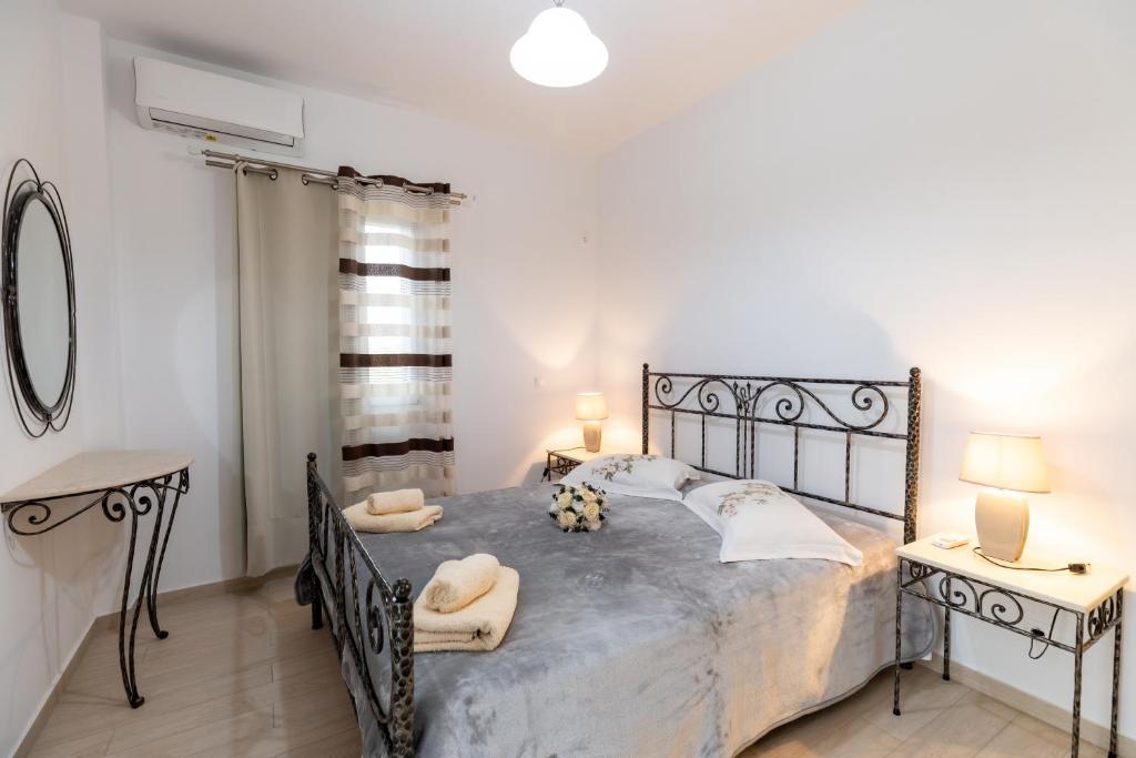 Postel nebo postele na pokoji v ubytování Mariangelo House