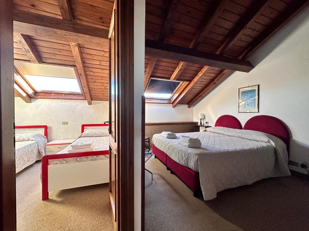 Postel nebo postele na pokoji v ubytování Hotel Alpi - Foza