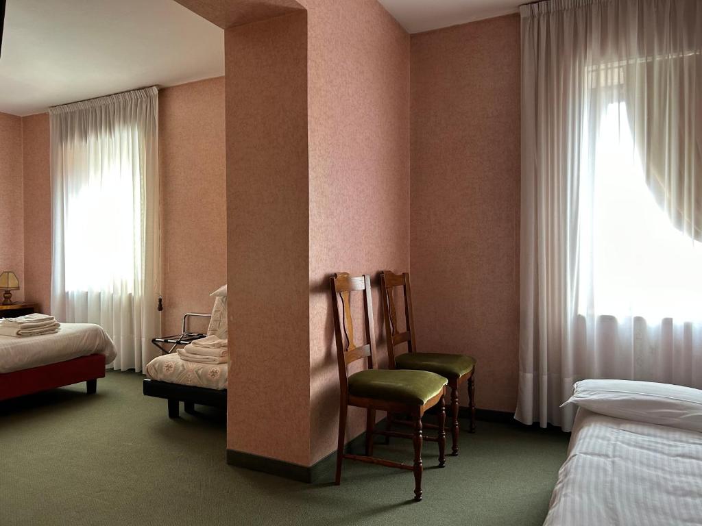 Postel nebo postele na pokoji v ubytování Hotel Alpi - Foza