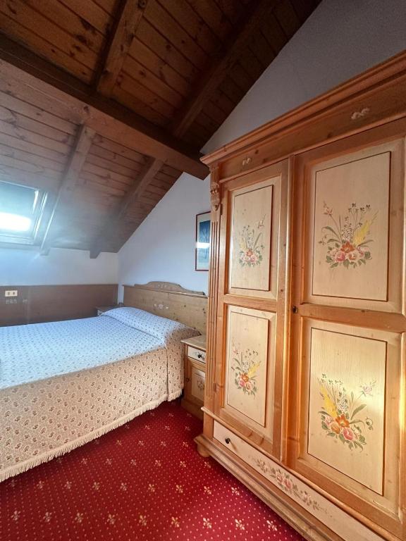 Postel nebo postele na pokoji v ubytování Hotel Alpi - Foza