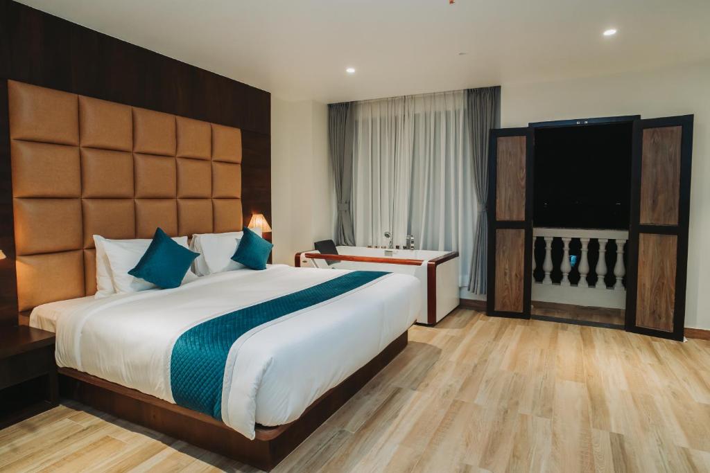 Postel nebo postele na pokoji v ubytování Dees Boutique Hotel