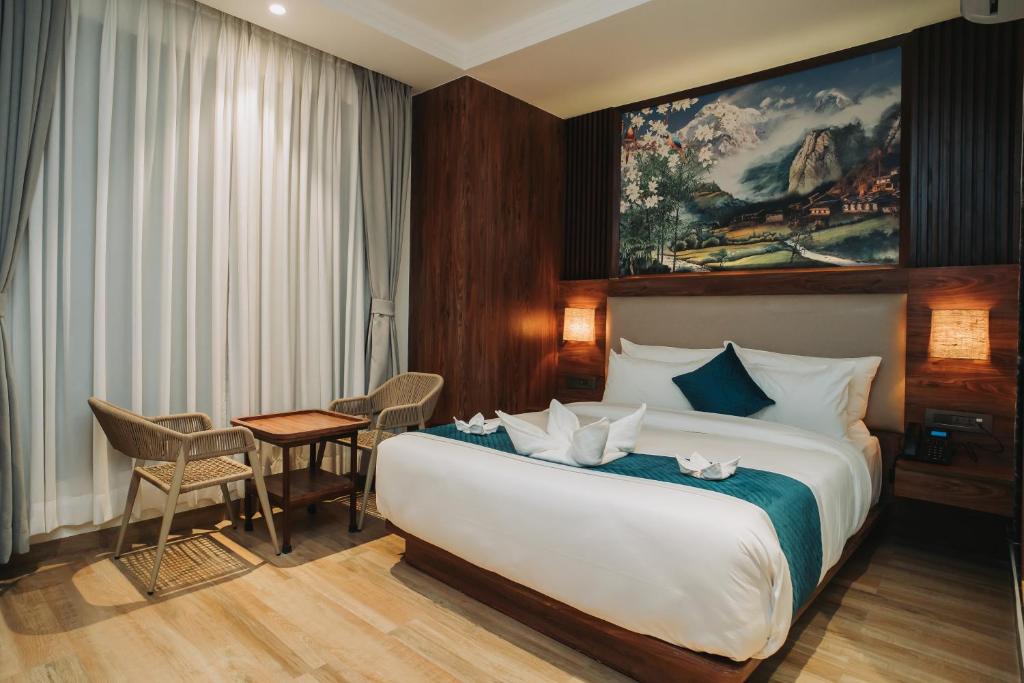 Postel nebo postele na pokoji v ubytování Dees Boutique Hotel