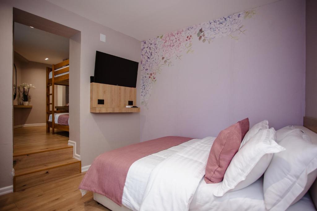 Cama o camas de una habitación en Oro Inn Hotel