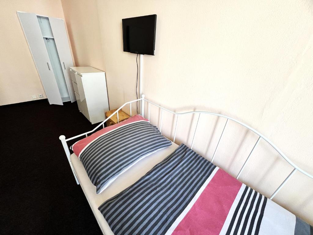 Postel nebo postele na pokoji v ubytování Hotel Penzion Rohožník