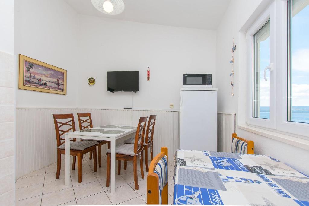 Televízia a/alebo spoločenská miestnosť v ubytovaní Apartment Terezija