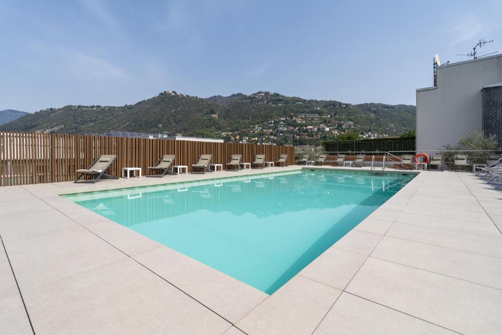 a swimming pool on top of a building at Hotel Como in Como