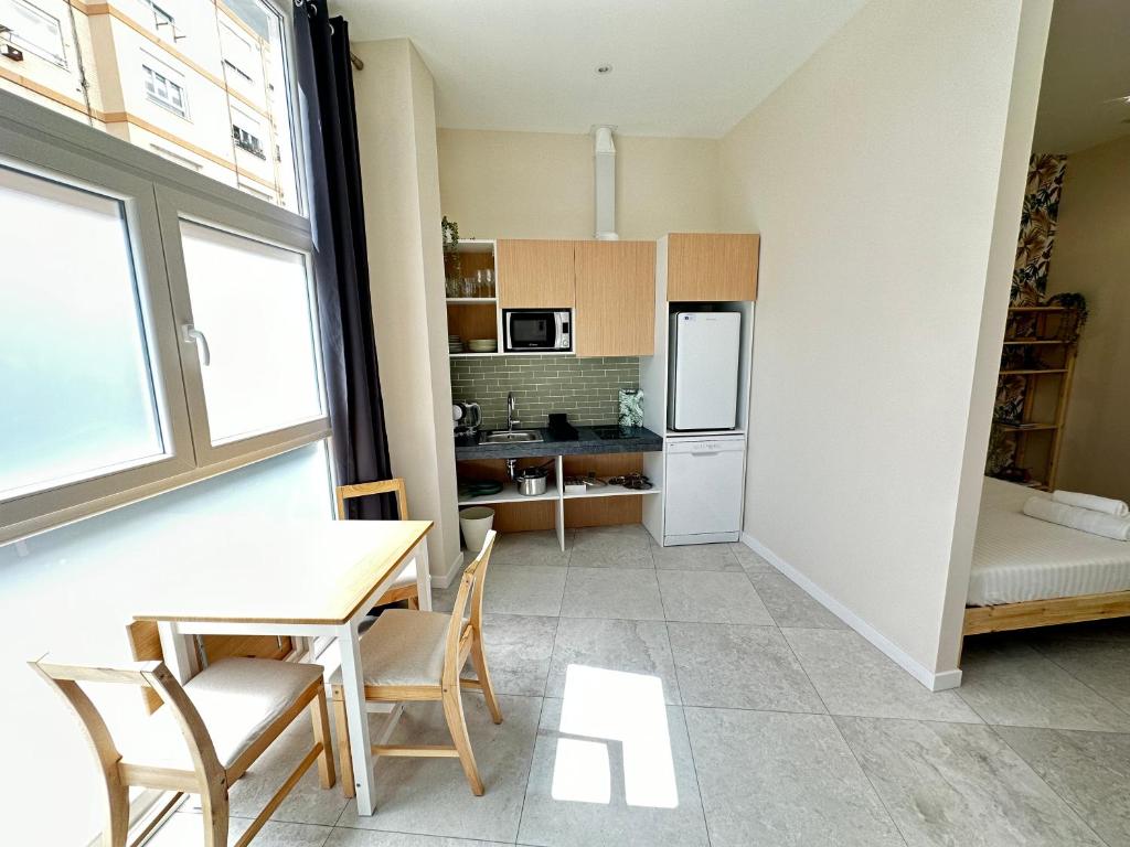 Kuchyň nebo kuchyňský kout v ubytování Calma Lofts
