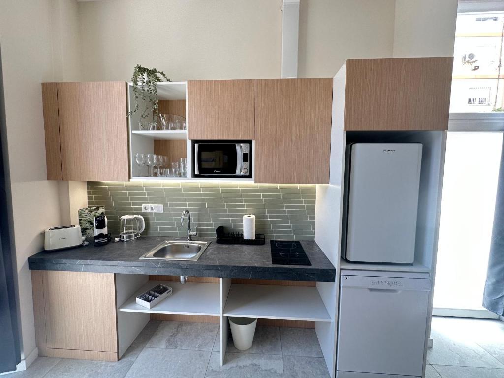 Kuchyň nebo kuchyňský kout v ubytování Calma Lofts