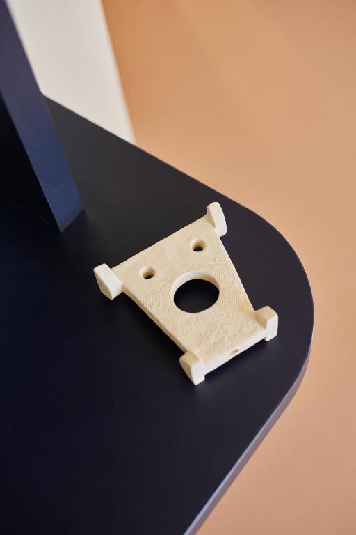 a wooden object sitting on top of a table at Hotel des Victoires - Restaurant in Cannes