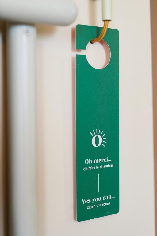 a green card hanging on a door at Hotel des Victoires - Restaurant in Cannes