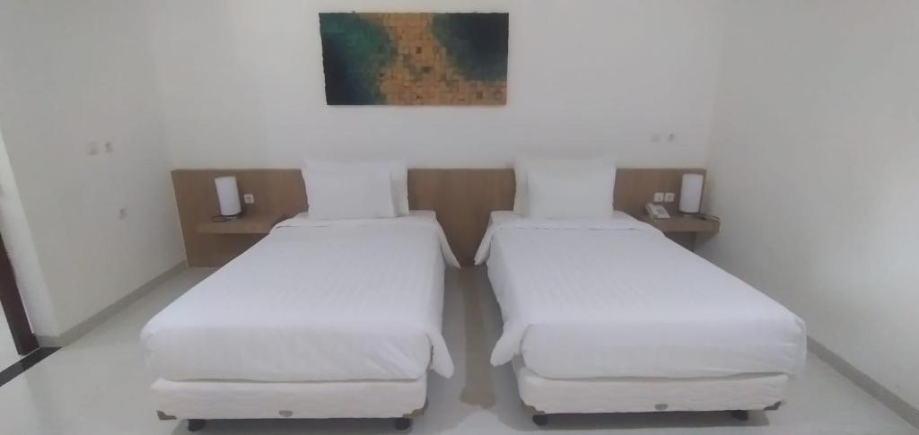 Postel nebo postele na pokoji v ubytování New Belitung Holiday Resort