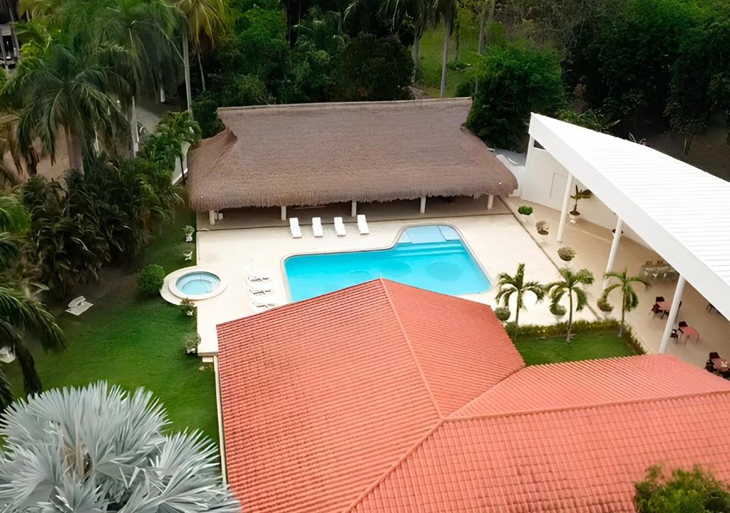 an aerial view of a house with a swimming pool at HOTEL SANTAFE NATURA - SANTAFE DE ANTIQUIA in Santa Fe de Antioquia