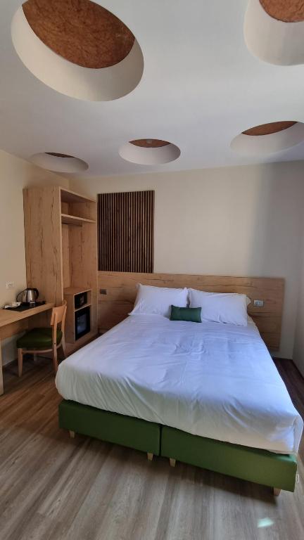 Postel nebo postele na pokoji v ubytování Botanique Hotel Vergani