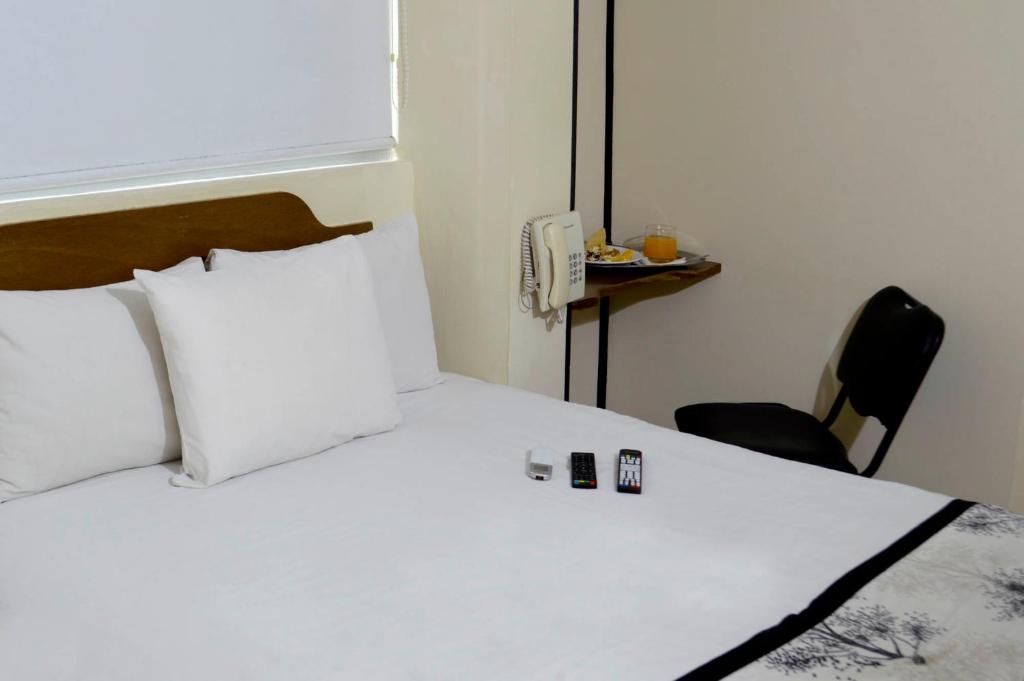 Postel nebo postele na pokoji v ubytování Hotel Mateos 1215