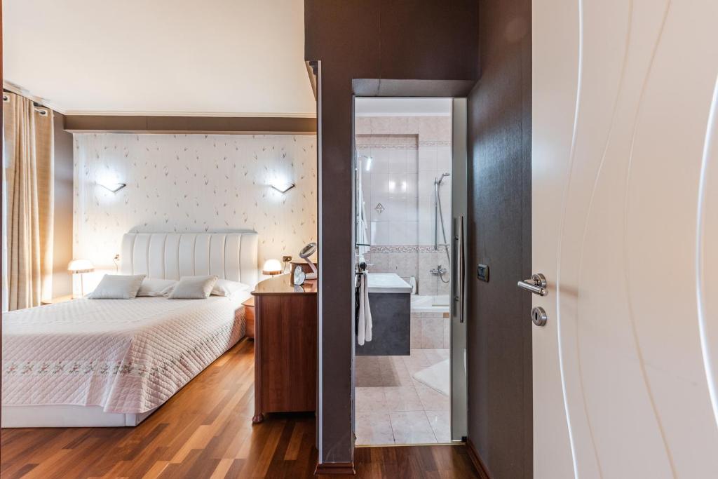 Postel nebo postele na pokoji v ubytování Vollga Seafront Suite by PS