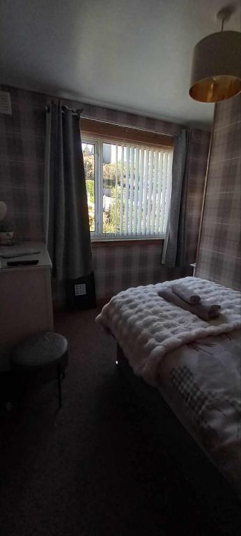 Postel nebo postele na pokoji v ubytování Don Muir Guesthouse