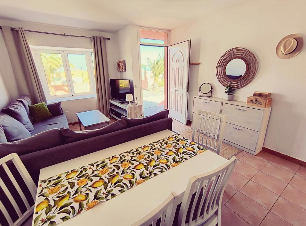 a living room with a couch and a table at Casa Noble in Costa de Antigua