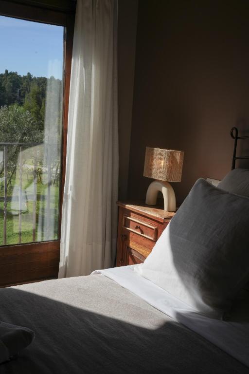 Posteľ alebo postele v izbe v ubytovaní Hotel Hort De Fortunyo