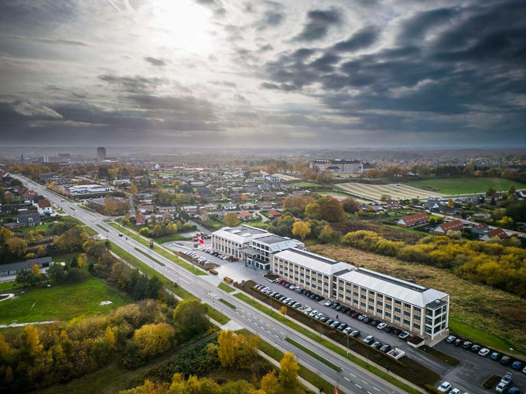 an aerial view of a large building in a city at Scandic Opus Horsens in Horsens