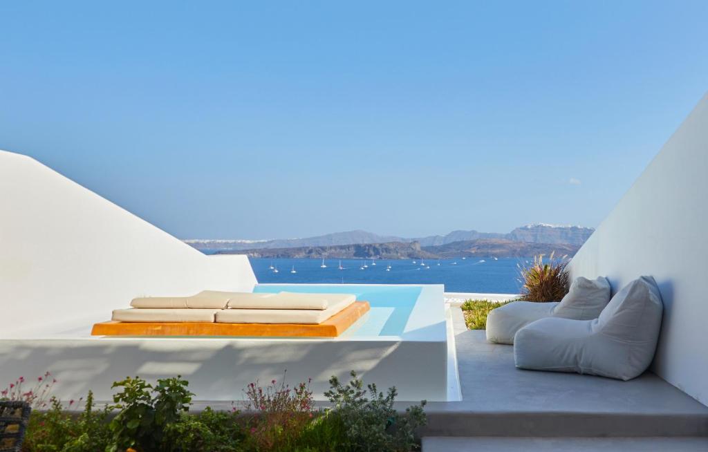a white house with a view of the water at Phos The Boutique in Akrotiri