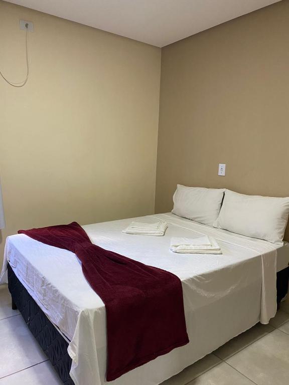 Cama ou camas em um quarto em Pousada Vista da Serra - Suzart