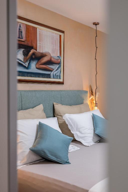 Posteľ alebo postele v izbe v ubytovaní Olive Shade - Apartment near the Beach