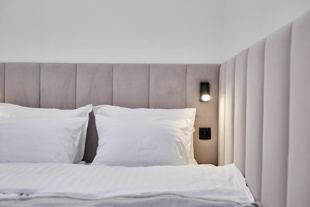Postel nebo postele na pokoji v ubytování Apart Hotel Acropolis