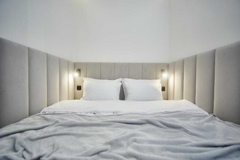 Postel nebo postele na pokoji v ubytování Apart Hotel Acropolis
