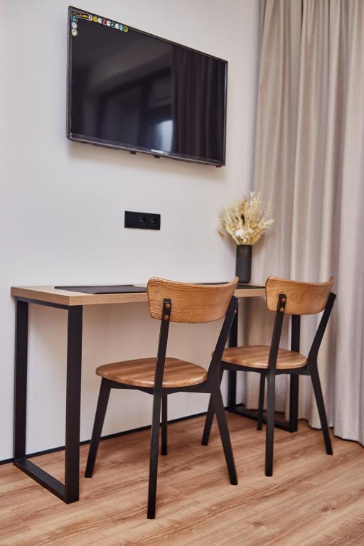 TV a/nebo společenská místnost v ubytování Apart Hotel Acropolis