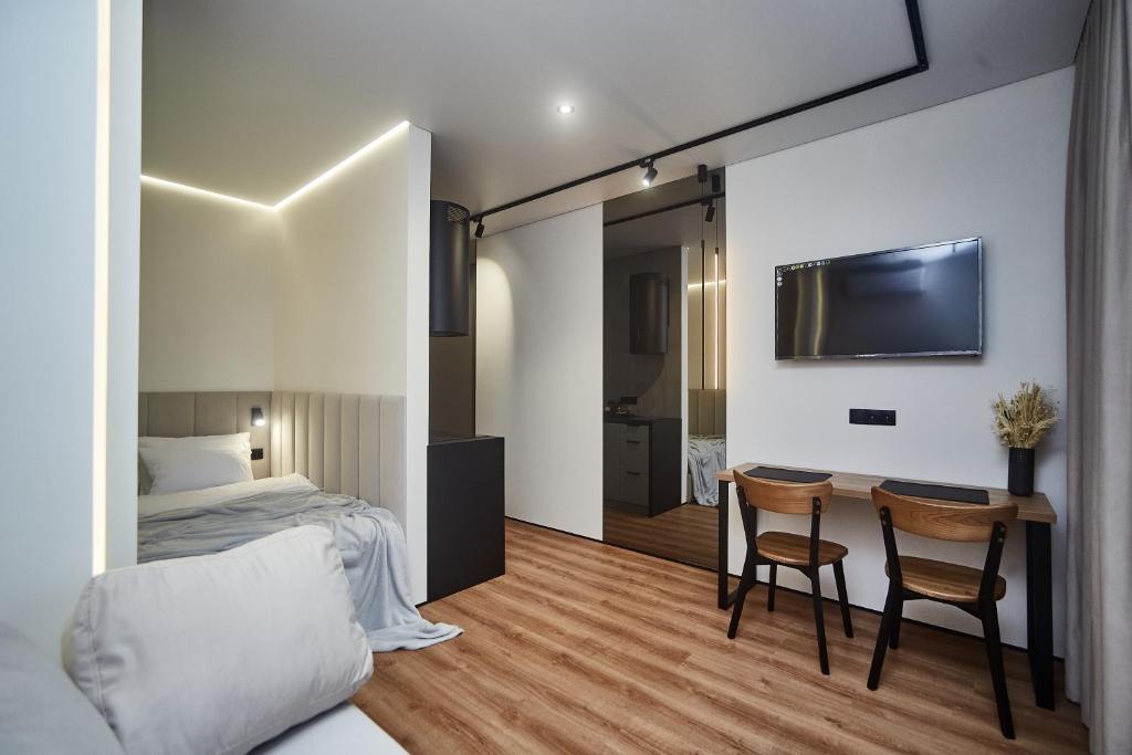 Postel nebo postele na pokoji v ubytování Apart Hotel Acropolis