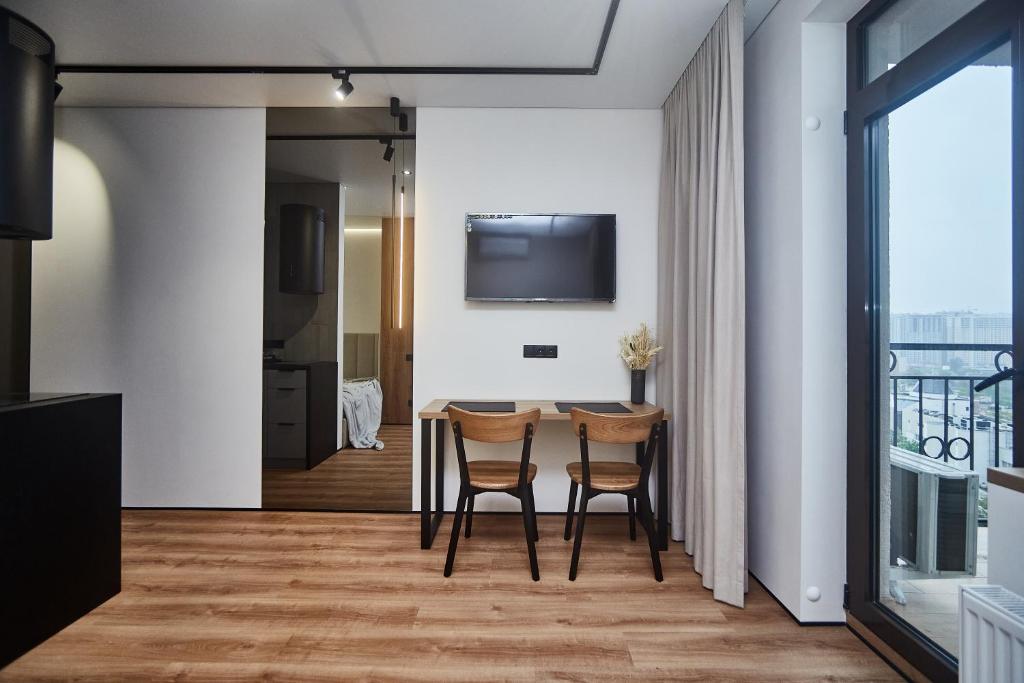 TV a/nebo společenská místnost v ubytování Apart Hotel Acropolis