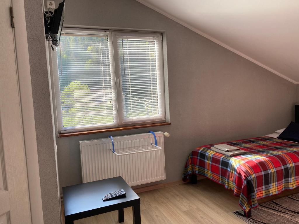 Postel nebo postele na pokoji v ubytování Mini-Hotel Serpanok