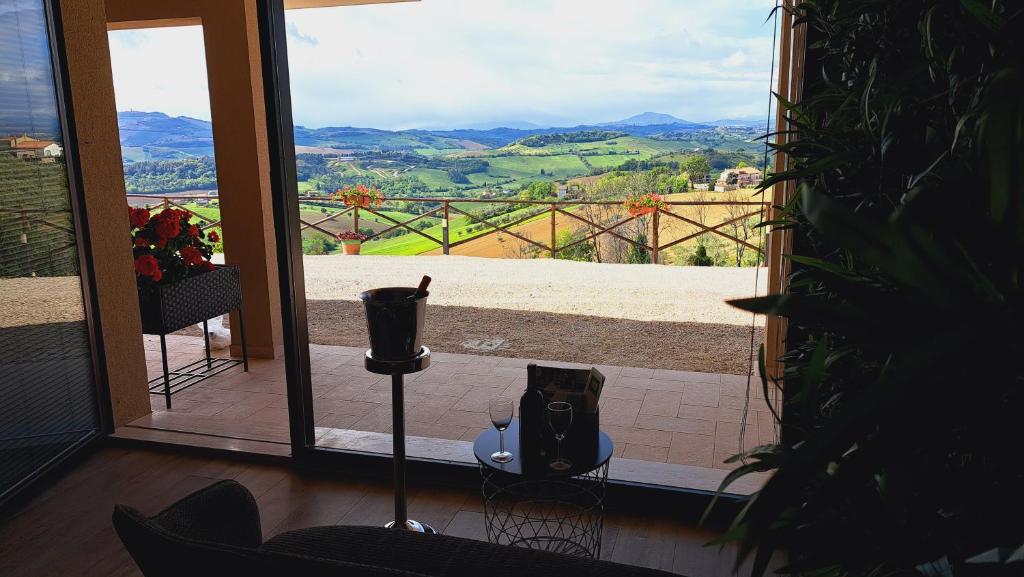 a room with a window with a view of the mountains at Tenuta Nonno Peppe in Fermo