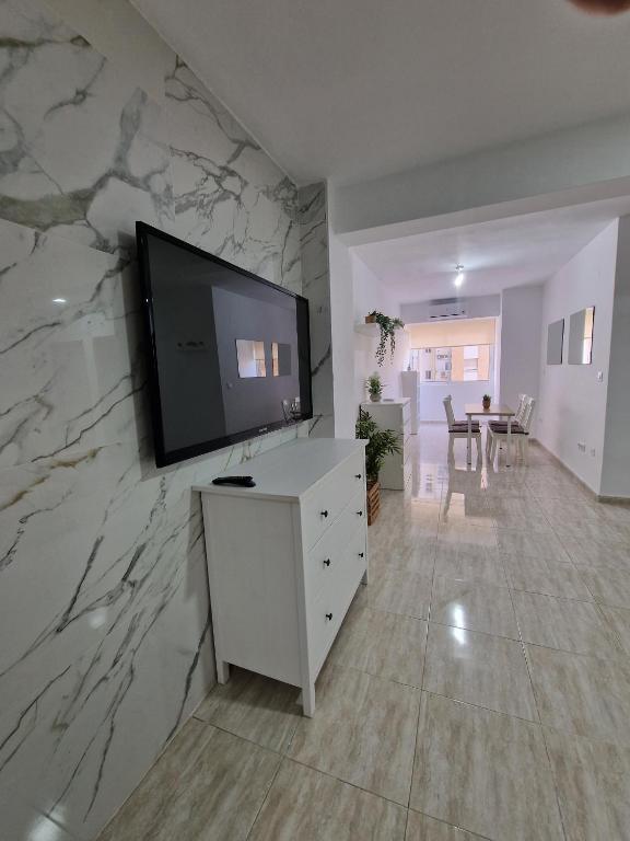 TV a/nebo společenská místnost v ubytování Virgen de Luján Triana