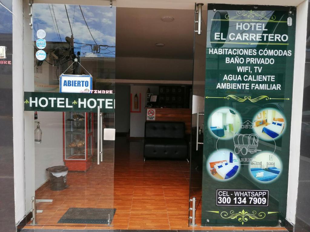 a building with a sign for a hotel at Hotel El Carretero in Popayan