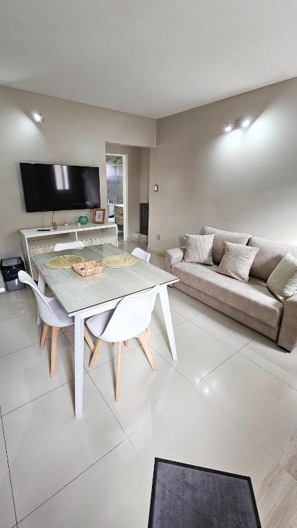 a living room with a table and a couch at Bruno`s Haven in Neuquén